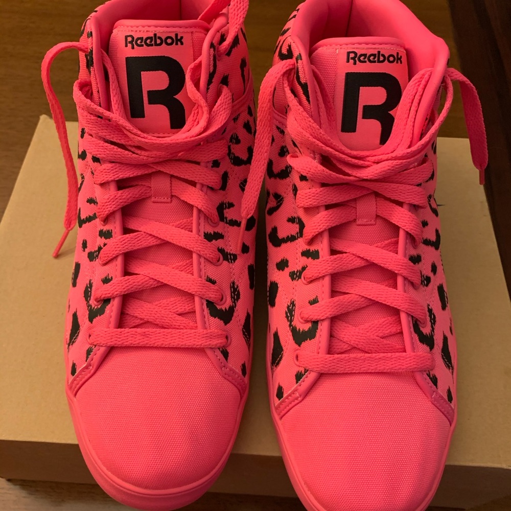 Men’s Reebok bright pink high top athletic shoes